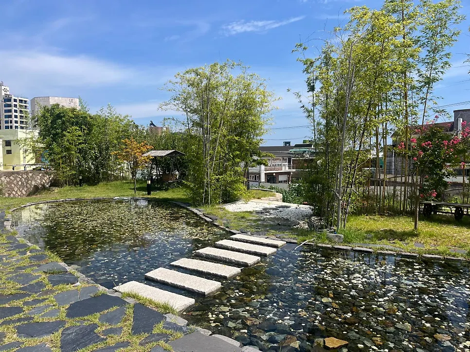 Small pond and stepping stones in front of the building