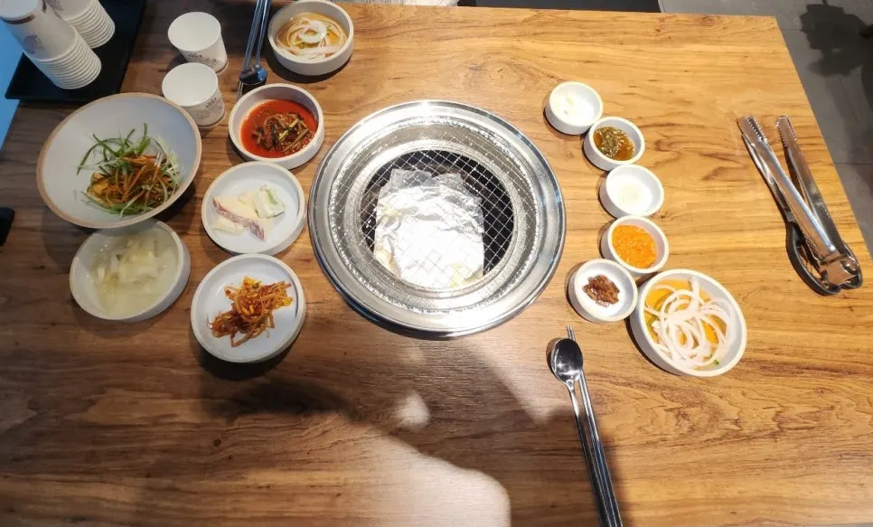 Table set with basic side dishes and doenjang jjigae