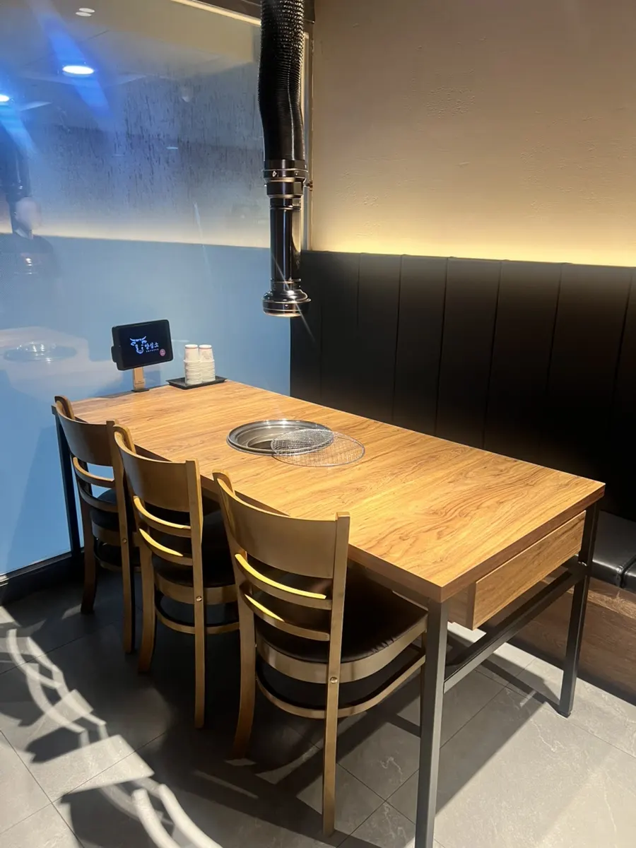 Table with the grill set up at Yangsimso, a beef restaurant in Gojan-dong