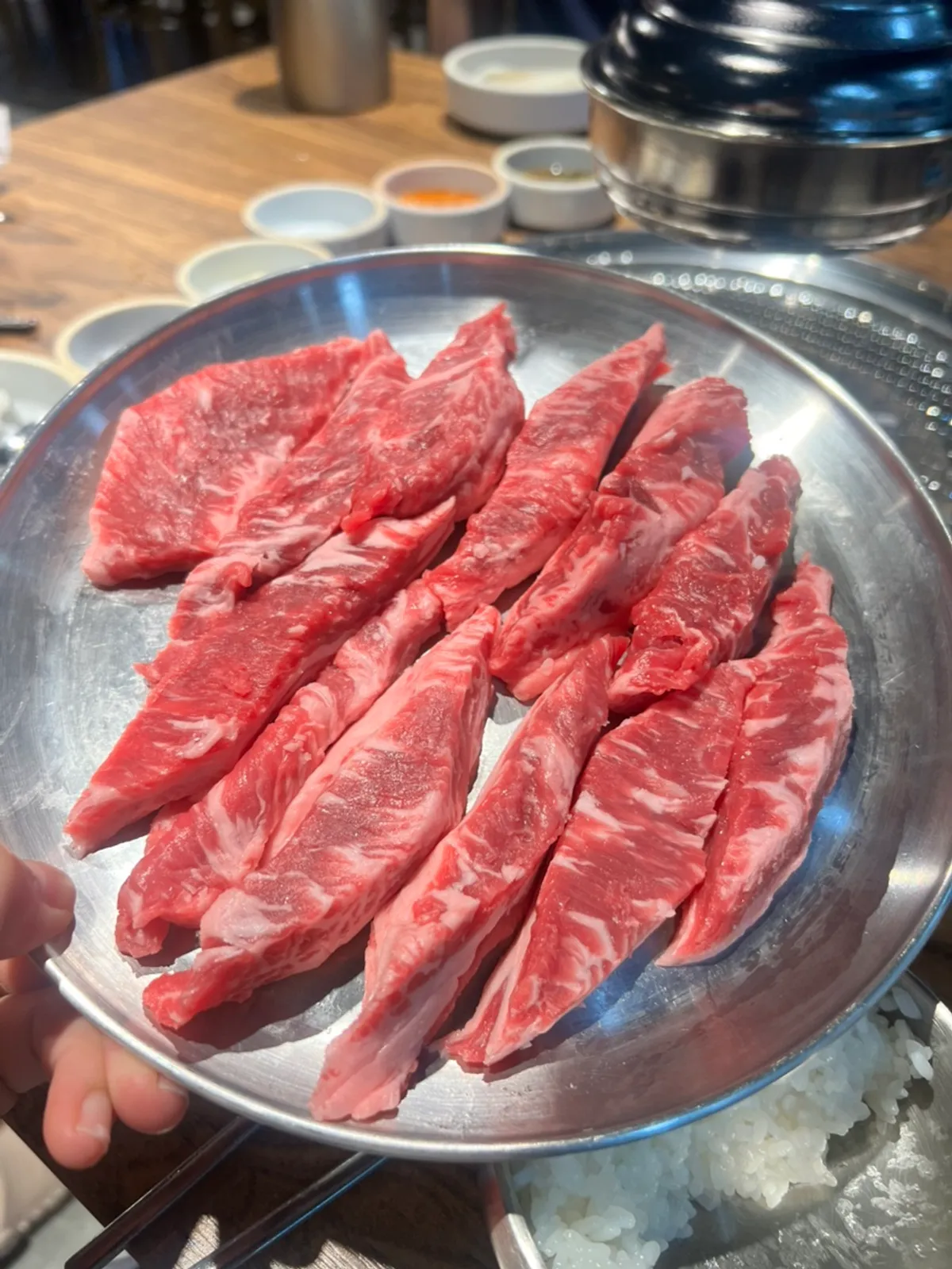 Beef grilling over charcoal