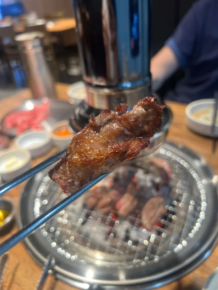 Enjoying Yangsimso beef wrapped in lettuce