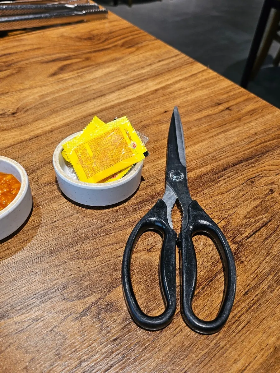 Extra side dishes and sauces at the self-serve bar