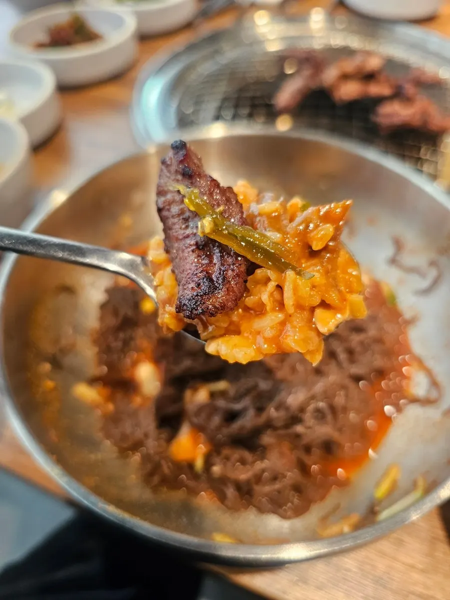 Full spread of bibim naengmyeon and marinated galbisal