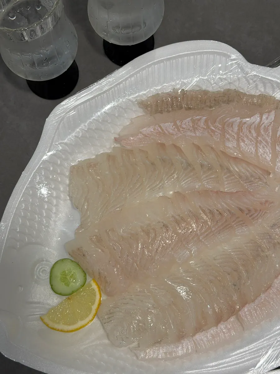 Halibut sashimi with soy sauce and wasabi