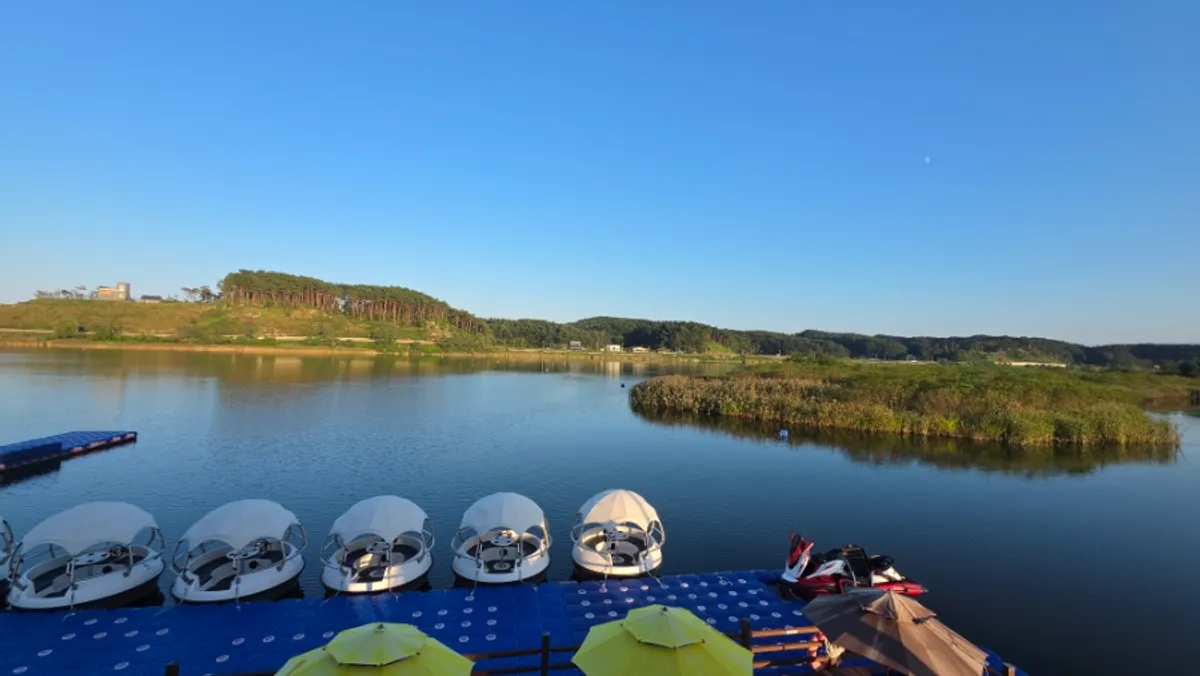 Electric boat cruising the Namdaecheon River with drinks aboard