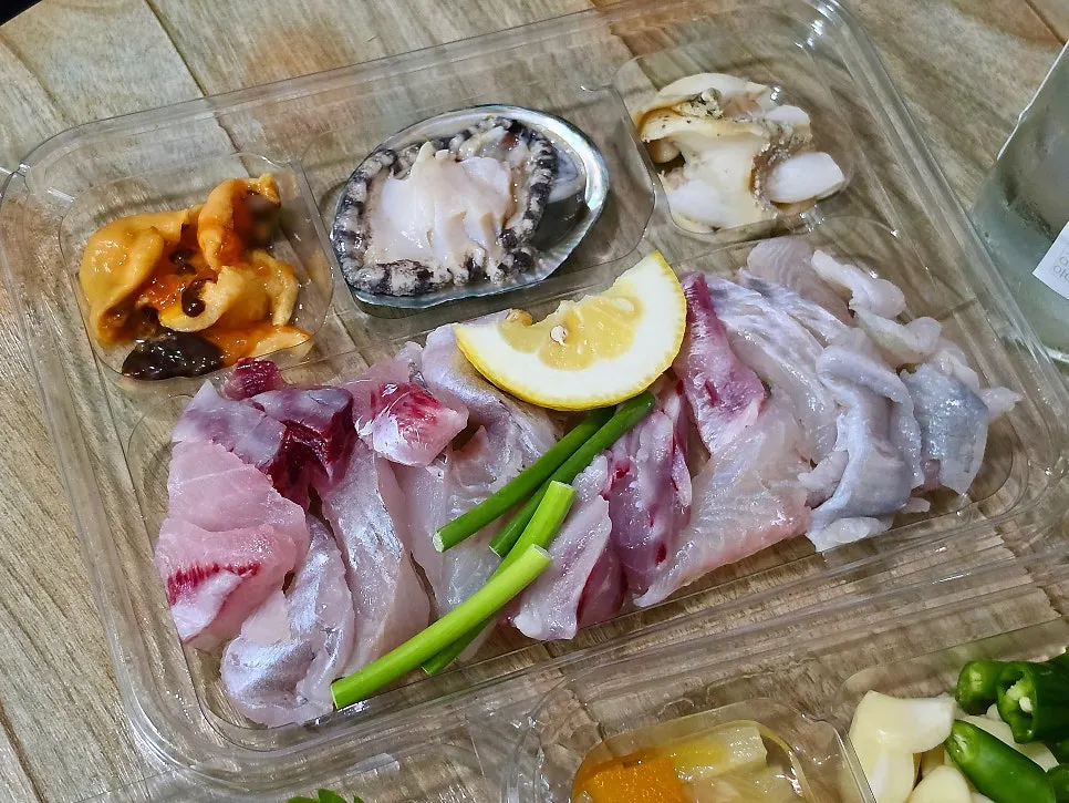 Assorted sashimi plate with seafood sides