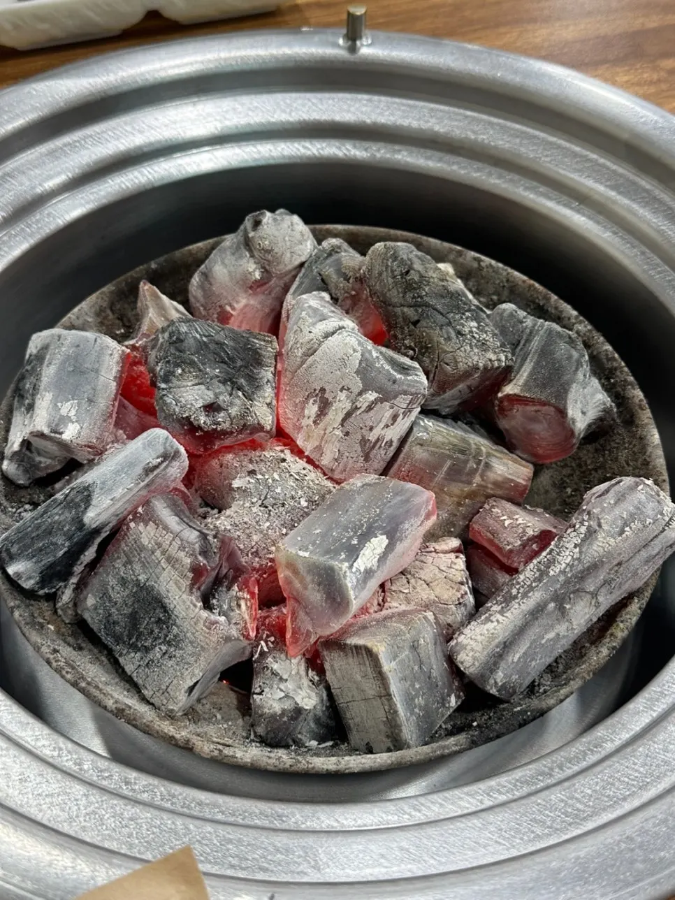 Coffee-wood binchotan charcoal placed on the table at Yeoyejeong