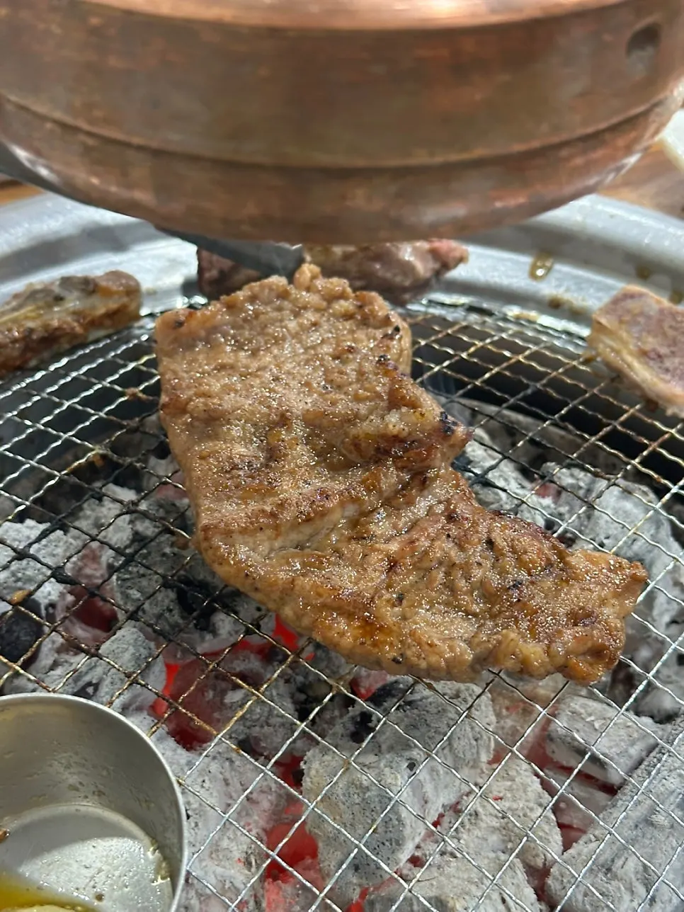 Marinated ribs grilling over the charcoal