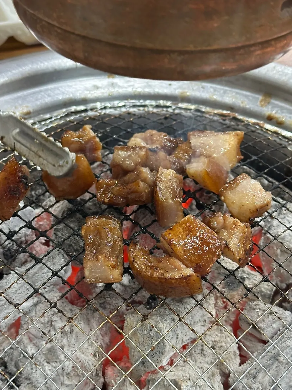 Soy-marinated pork tail grilled over charcoal