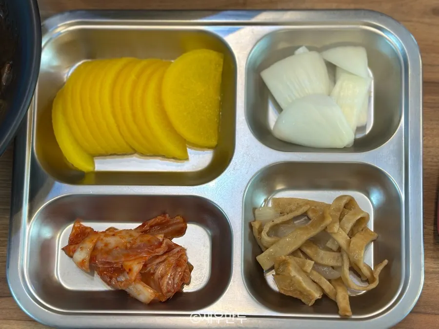 Basic side dishes: pickled radish, kimchi, stir-fried fish cake, raw onion and ssamjang
