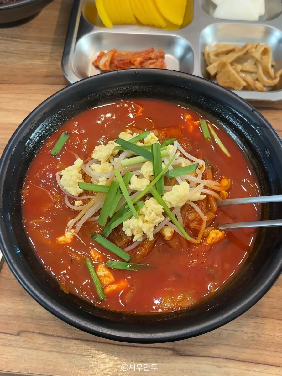Chicken jjamppong topped with soft tofu, bean sprouts, and chives