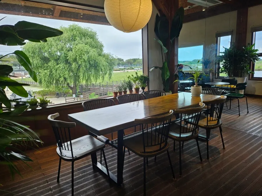 Floor-to-ceiling café window overlooking Namdaecheon