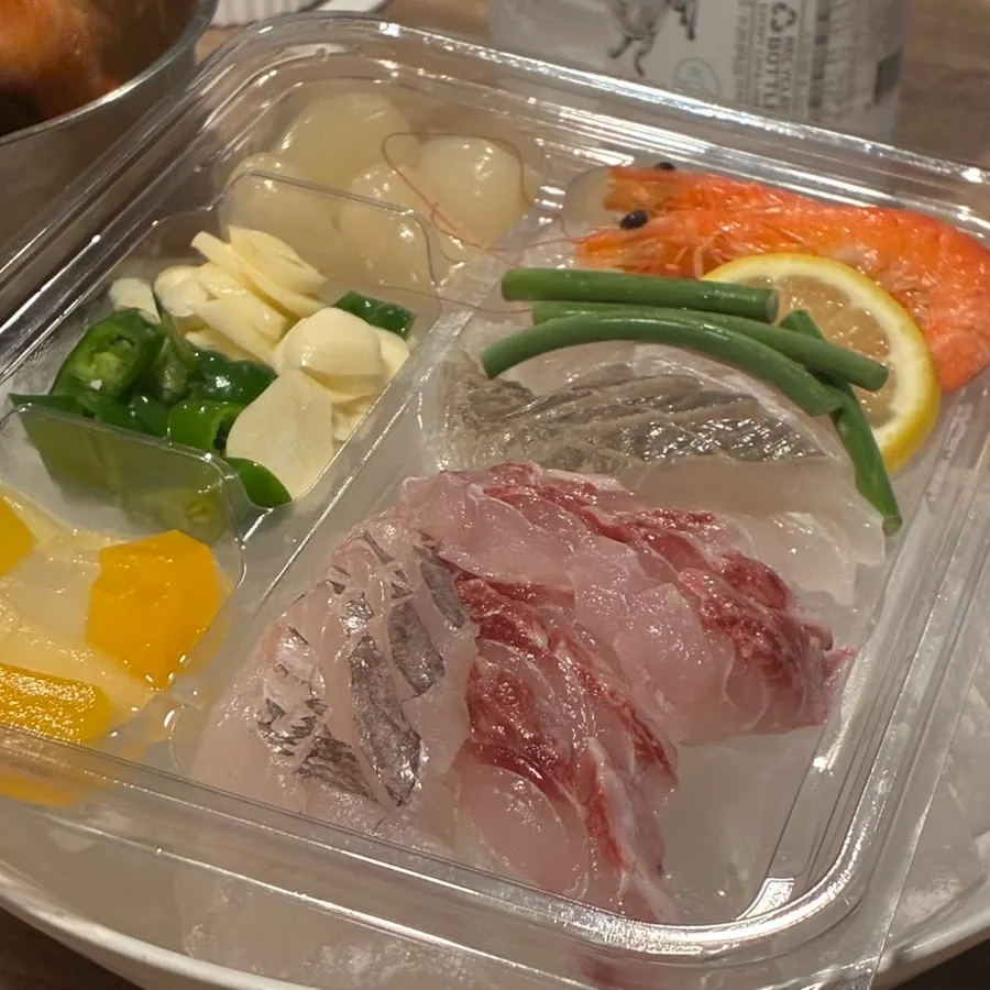 Plate of assorted sashimi laid over ice