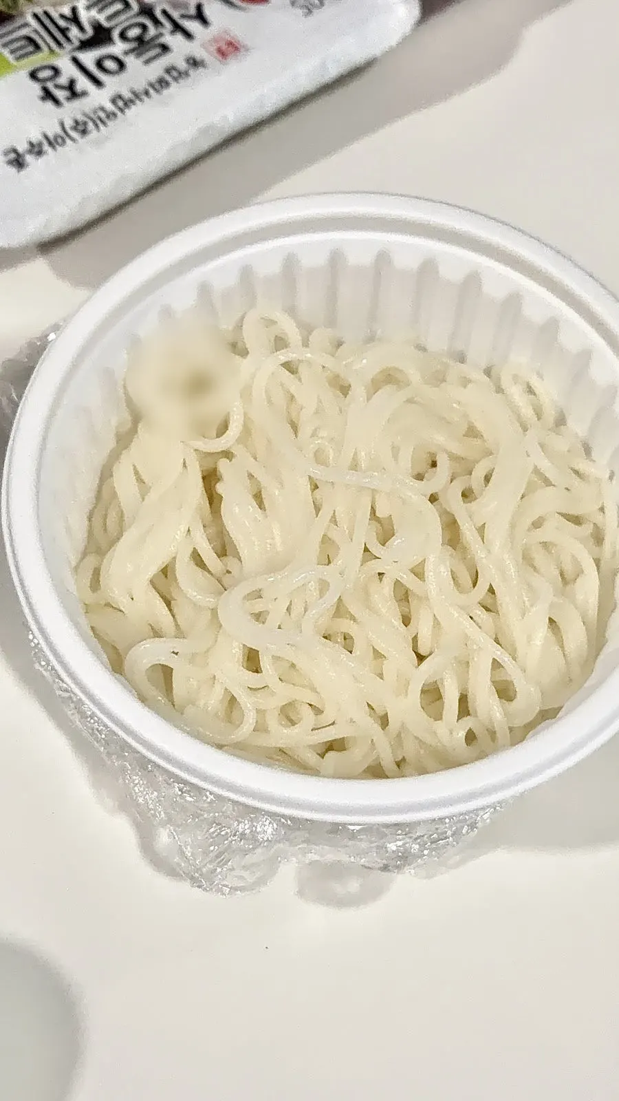 Noodles being slurped in mulhoe broth