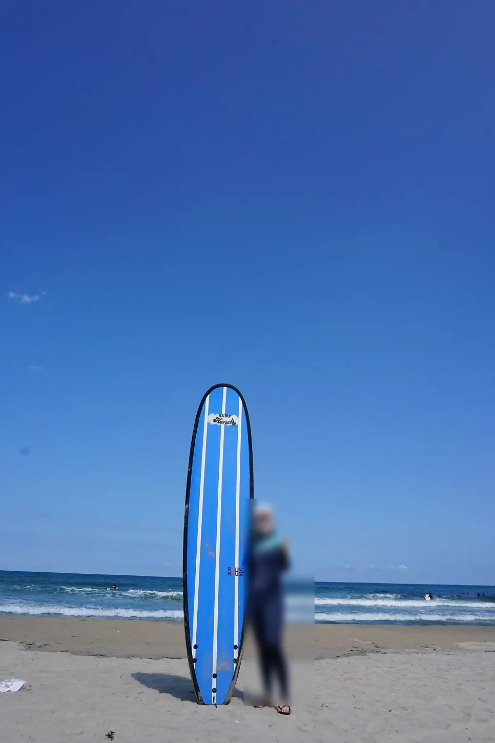 Photo-of-a-lifetime shot at the surfboard photo zone on Seolak Beach
