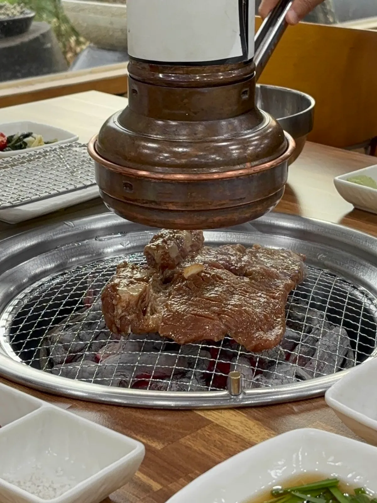 Marinated ribs cooking over charcoal