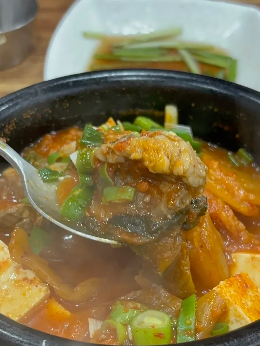 Kimchi jjigae broth with thick-cut aged kimchi