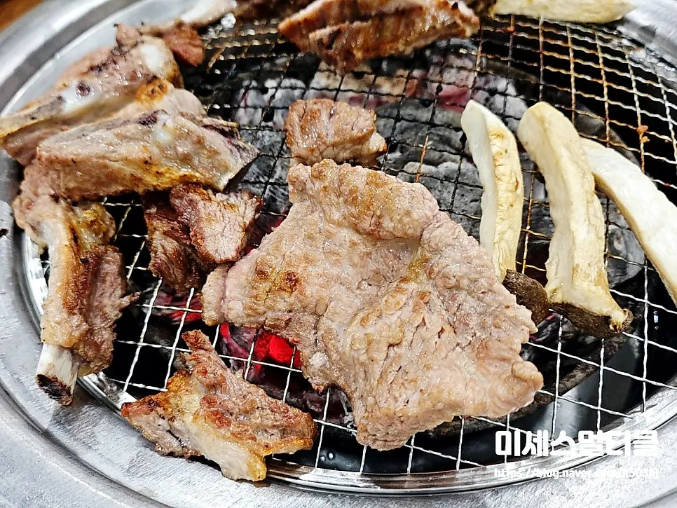 A piece of fresh galbi on a lettuce leaf