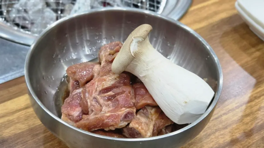 Two servings of marinated galbi plated