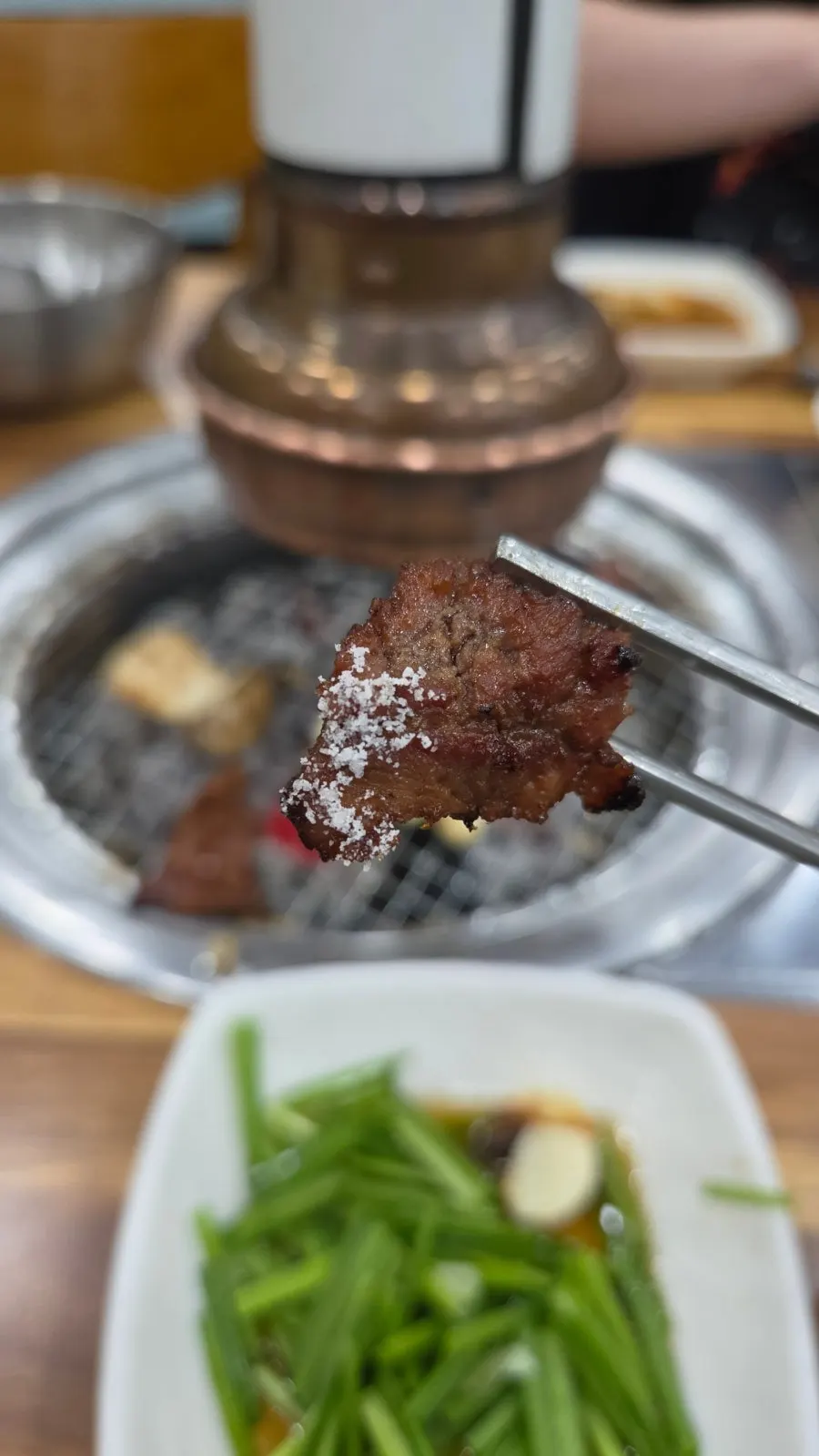 Vertical shot of butterflied ribs marinated in-house