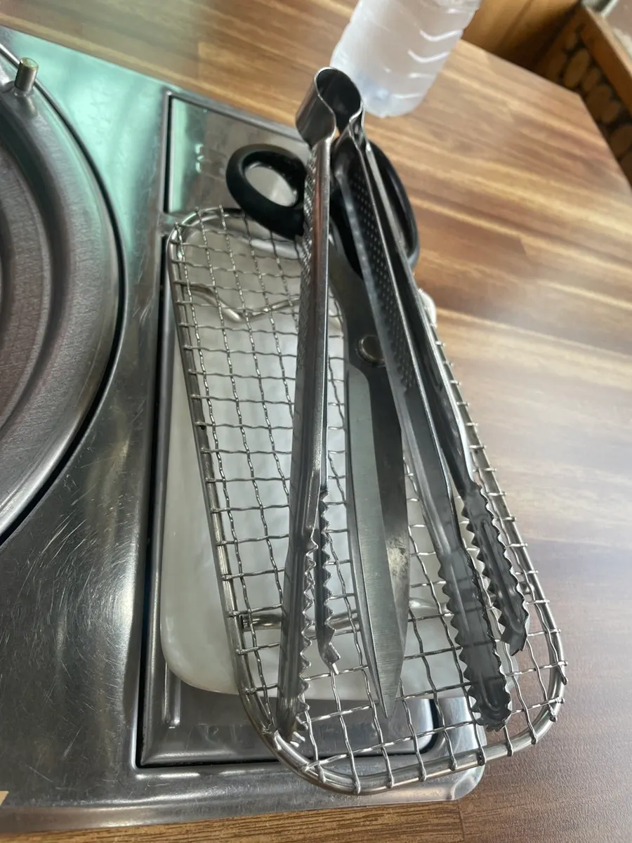 Table with wrapped utensils and bottled water