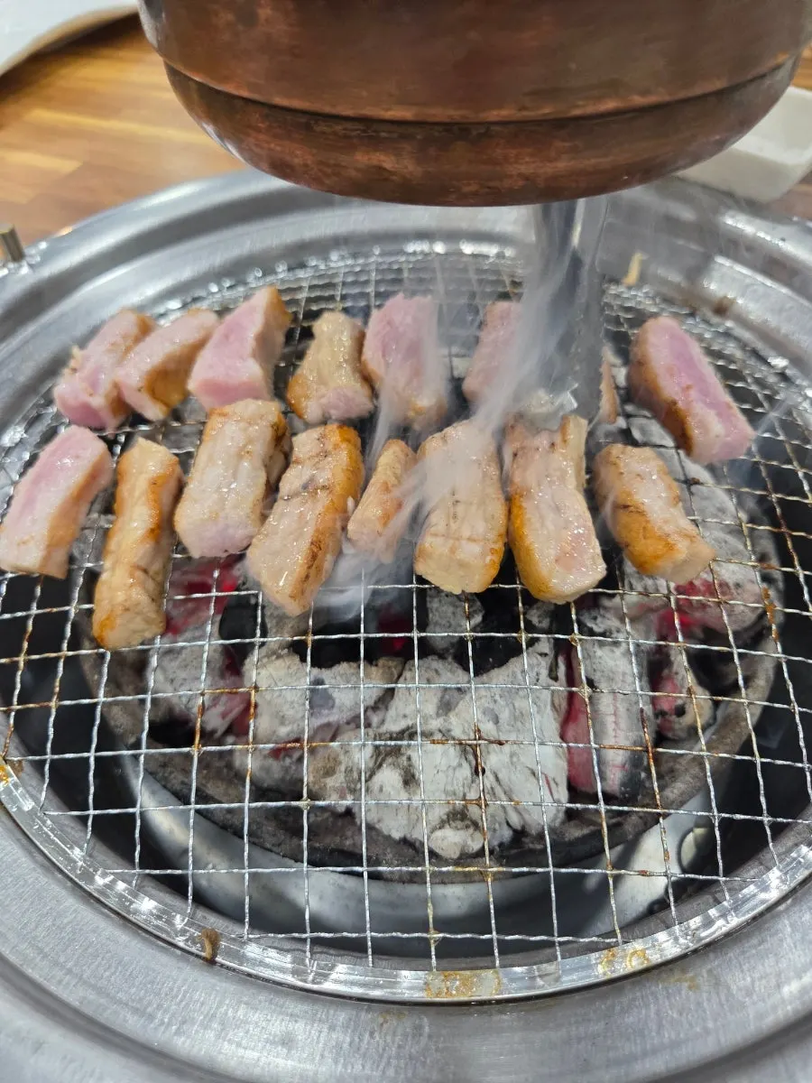Raw pink-hued aged pork jowl