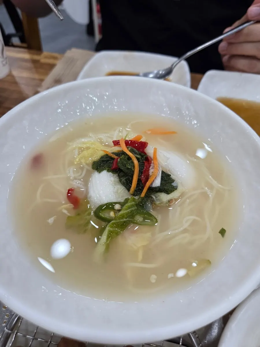 A spread of bomb-style steamed egg, pot rice, and doenjang jjigae