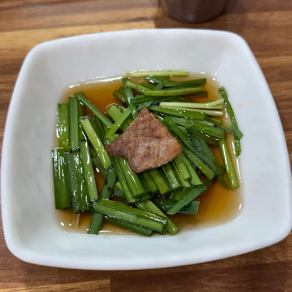A piece of fresh rib dipped in chive sauce