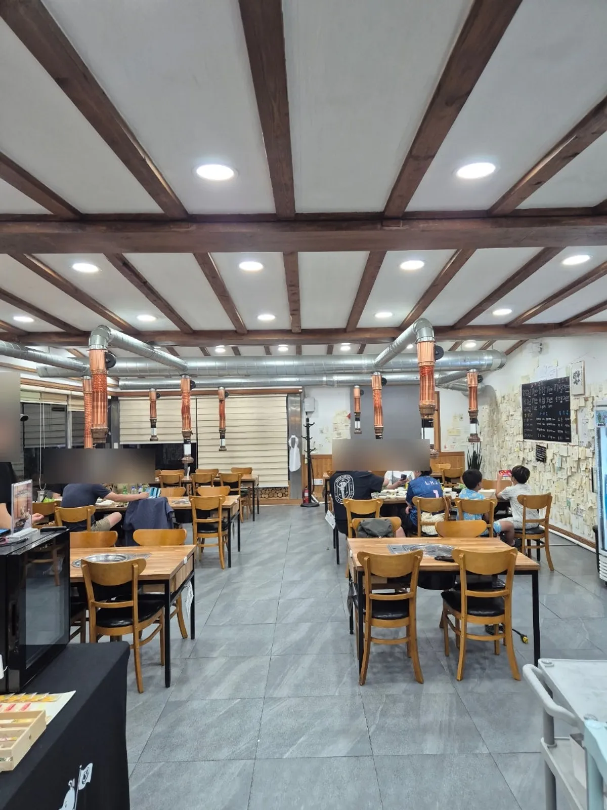 Spacious dining hall with grill tables at Yeoyejeong