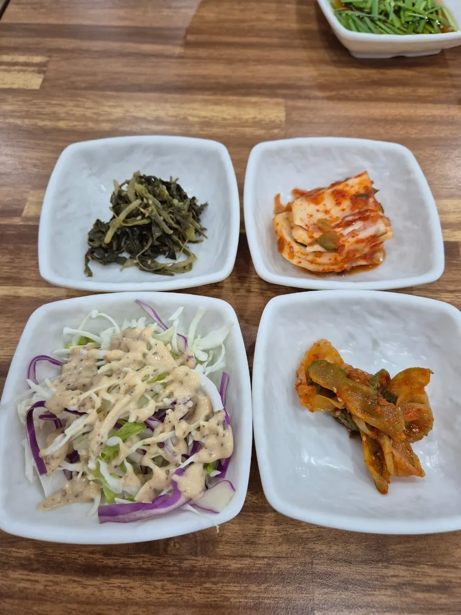Side dish spread served with a child's tableware