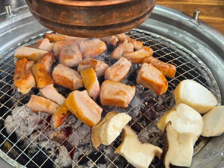 Pork jowl on the charcoal grill