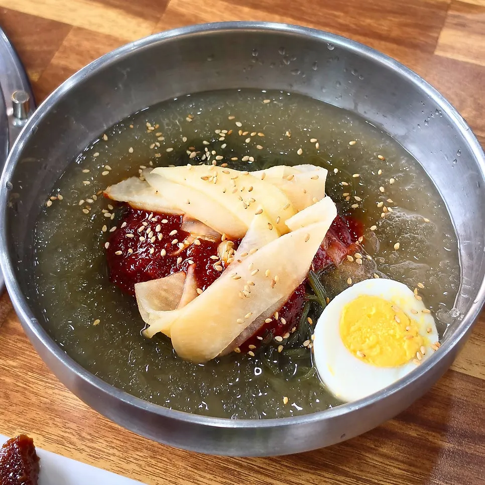 A bowl of meat naengmyeon with cool broth