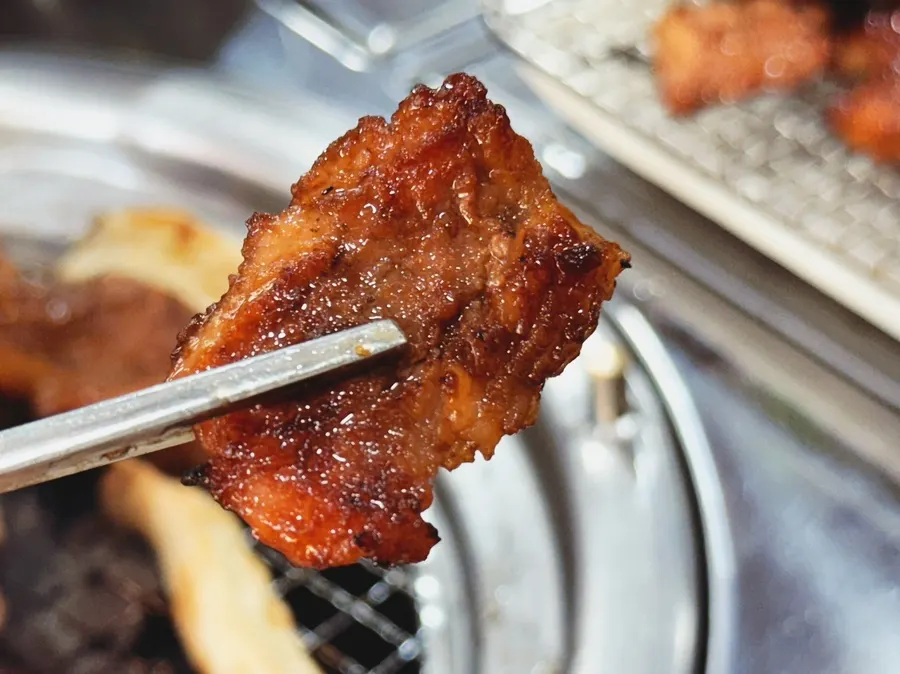 A piece of galbi with caramelized marinade