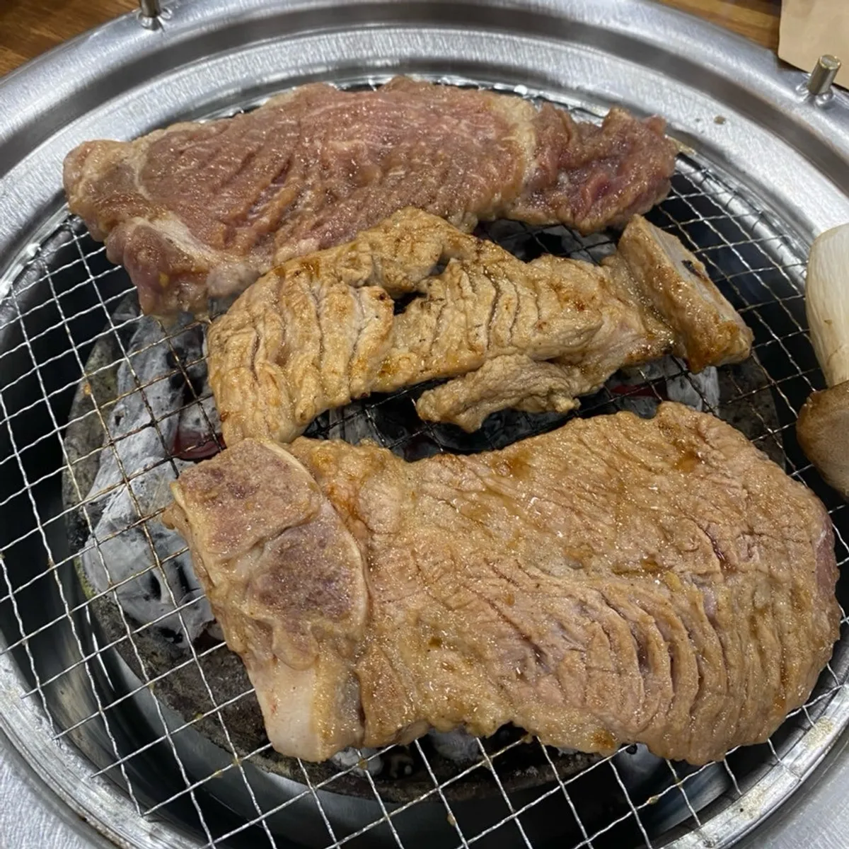 The full table spread with three servings of marinated ribs