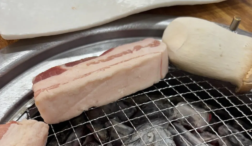 Thick raw pork belly served on a plate