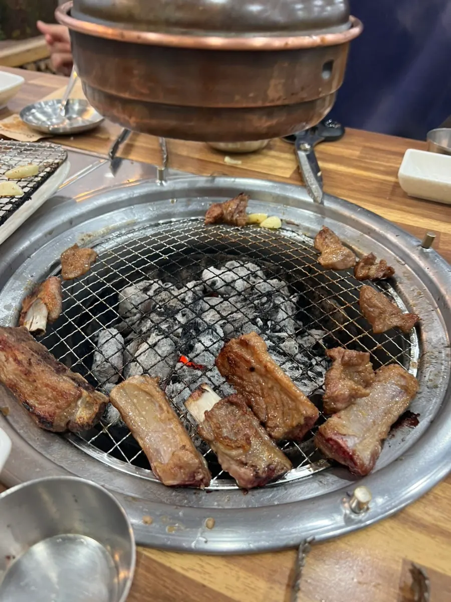 A bite of pork galbi with rice