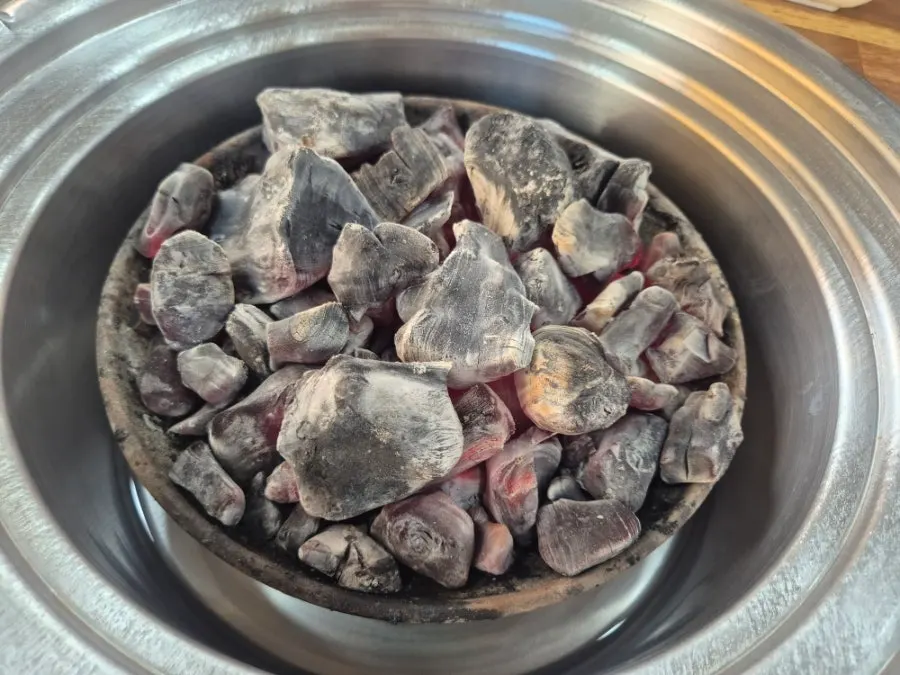 Charcoal grill brought to the table