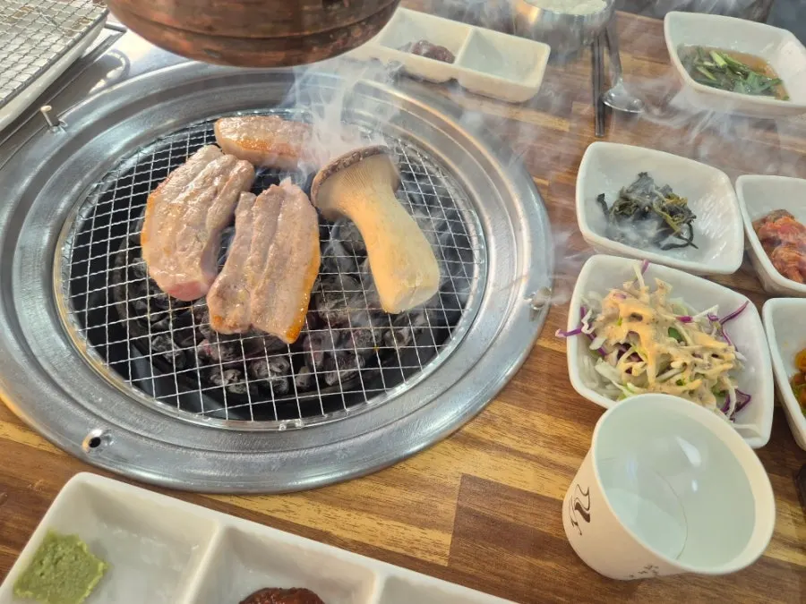 Charcoal pork belly turning golden brown