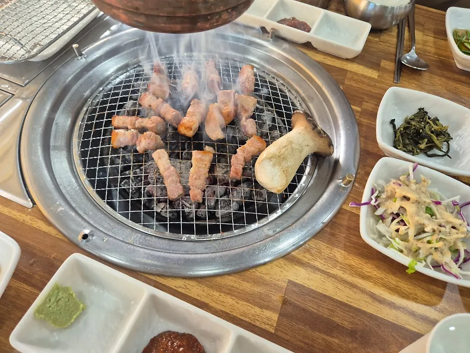 King oyster mushroom slowly grilling over charcoal