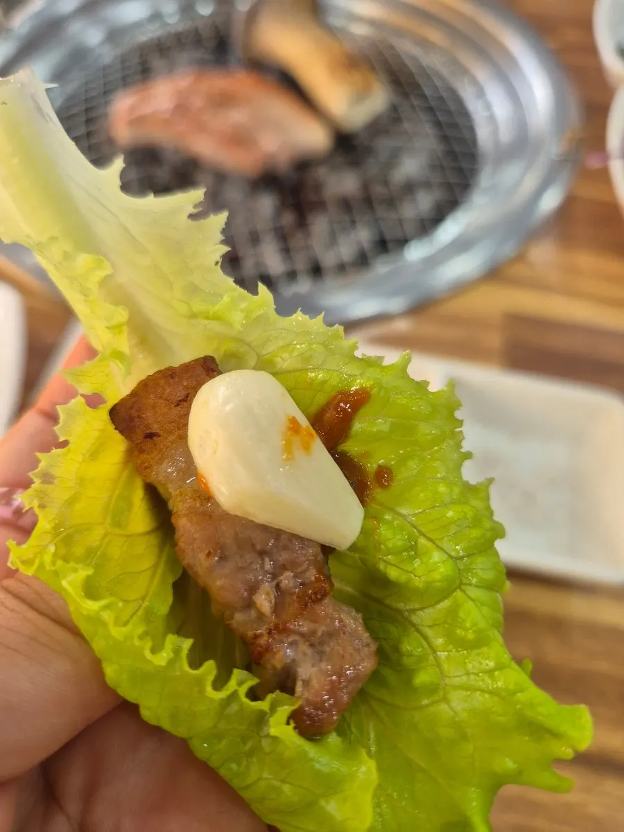Close-up of grilled pork belly and mushroom