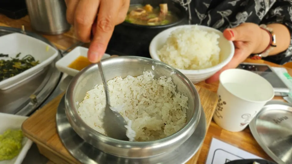 Fluffy pot rice with steam rising