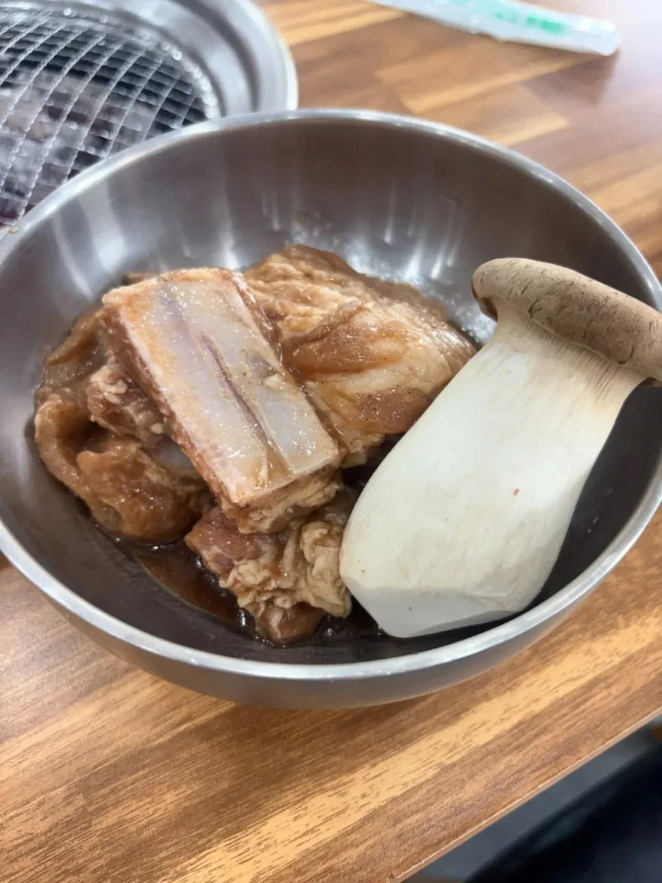 Two servings of marinated pork galbi with king oyster mushrooms