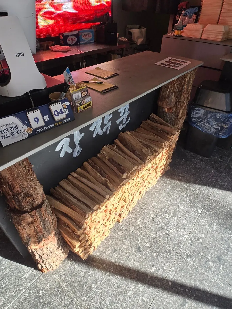 Wood-roasting machine for whole chicken outside the restaurant