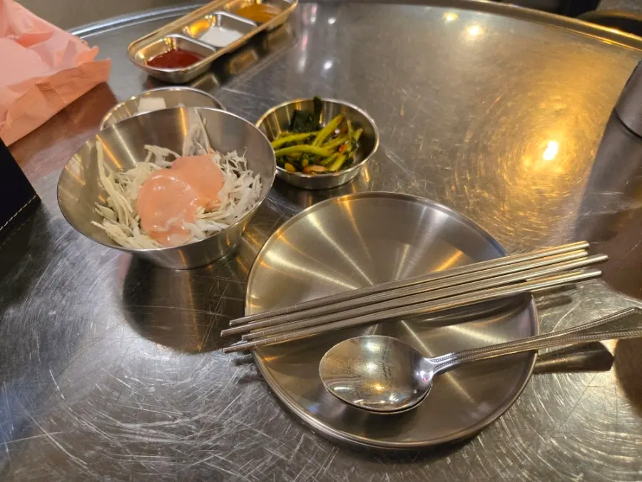 Basic side dishes of pickled radish, cabbage, and yeolmu kimchi