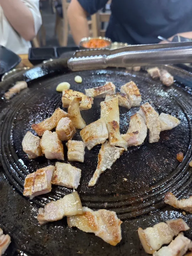 Whole pork jowl scored with crosshatch cuts