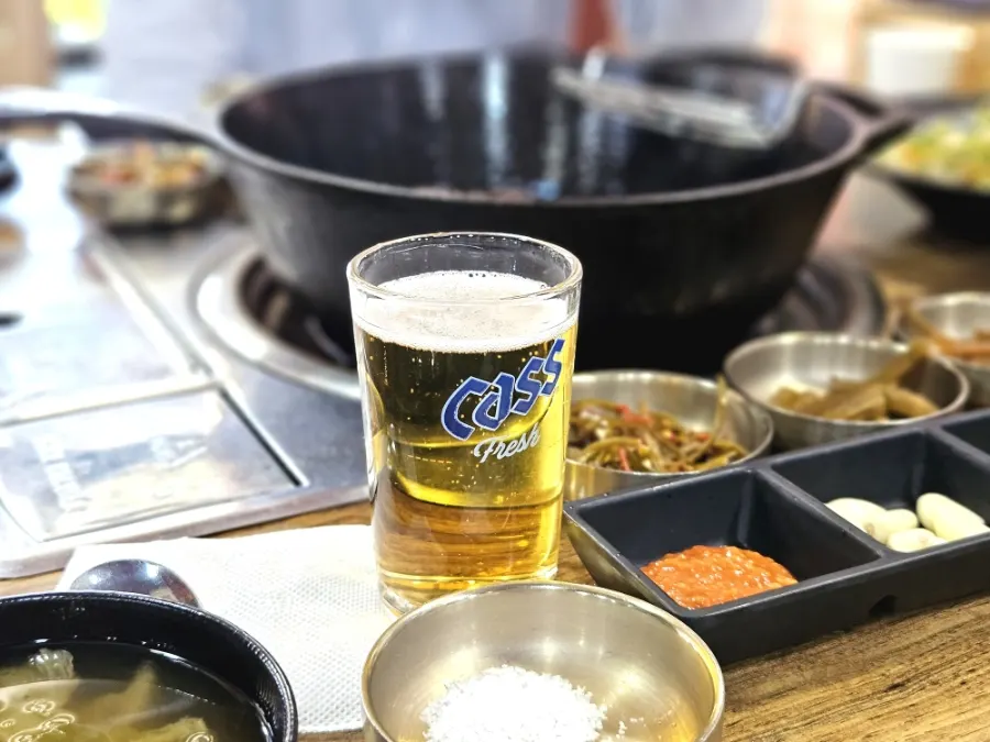 Table spread with hanwoo sirloin grilled on an iron pan
