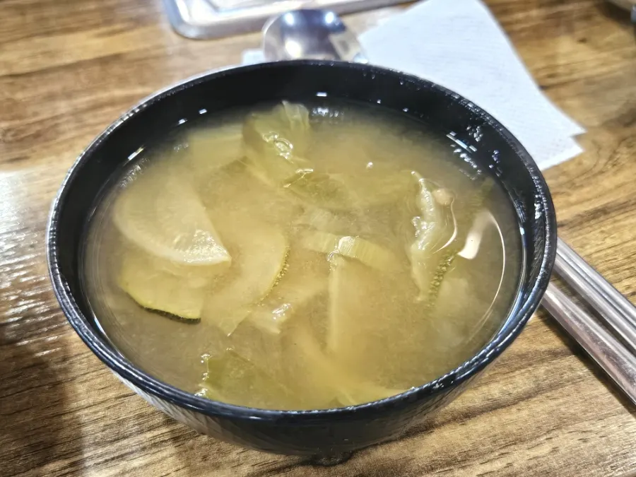 A bowl of spicy cabbage doenjang soup