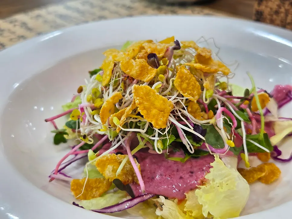 Plate of mung bean jelly topped with garnish