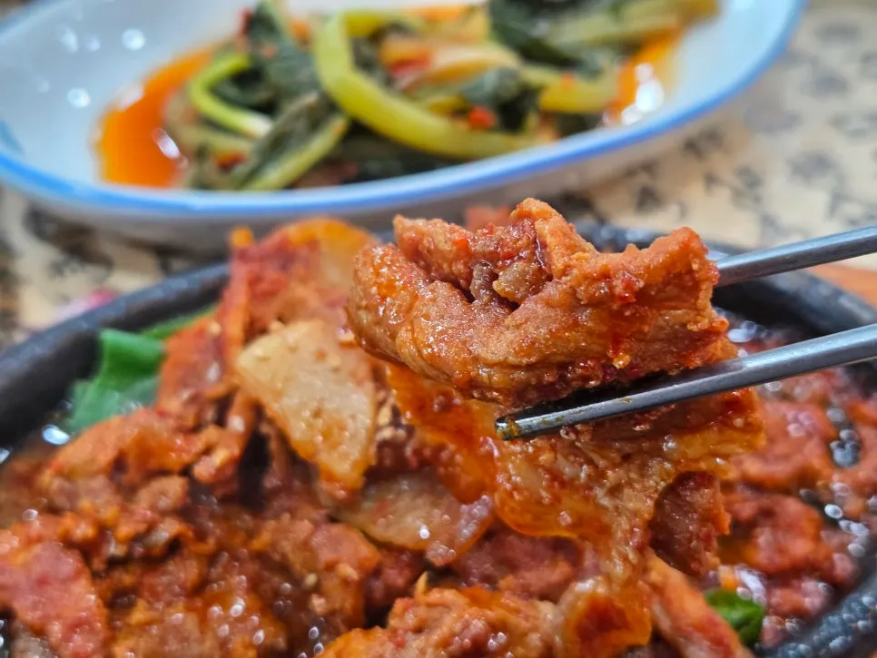 Soybean paste stew and stir-fried pork served alongside
