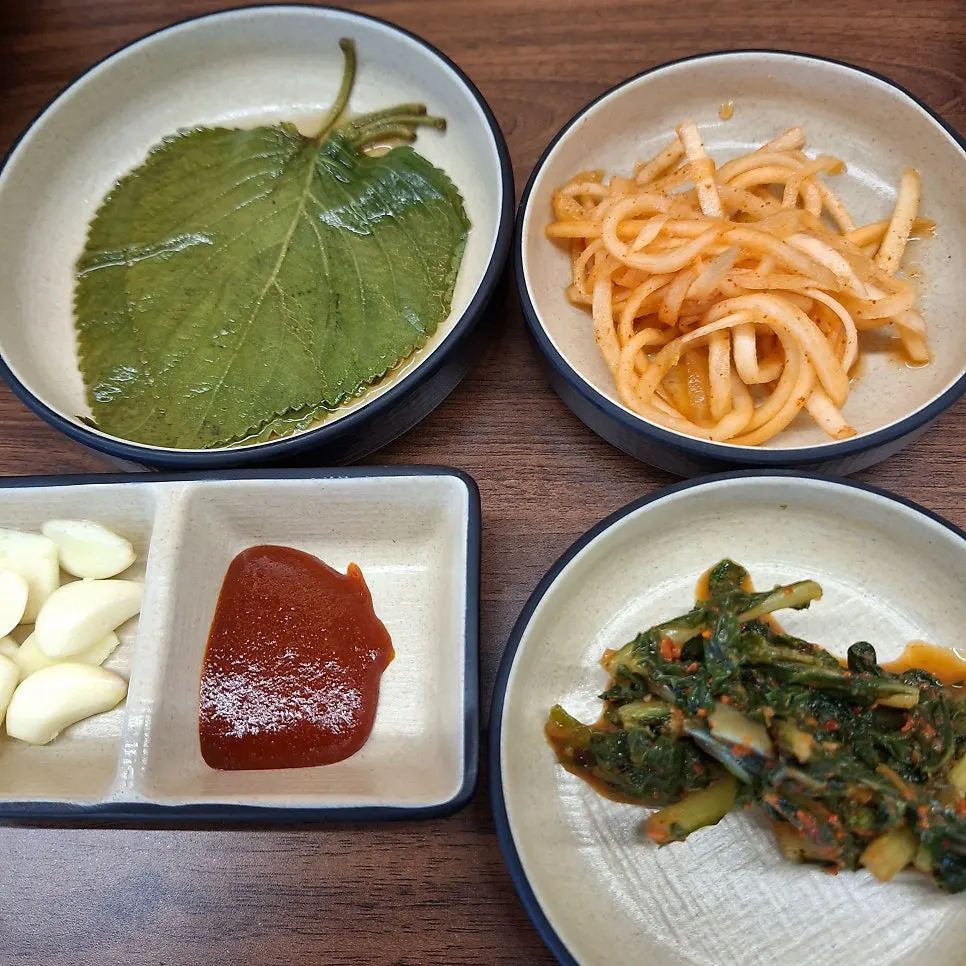 Bowl of dongchimi and basic side dishes